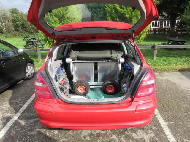 Carp Fishing Trolley Loaded into the rear of a car ready for trnsporting.