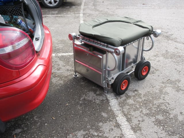 Carp Fishing Trolley Bed Chair Folded into a cubical shape ready for loading into a car