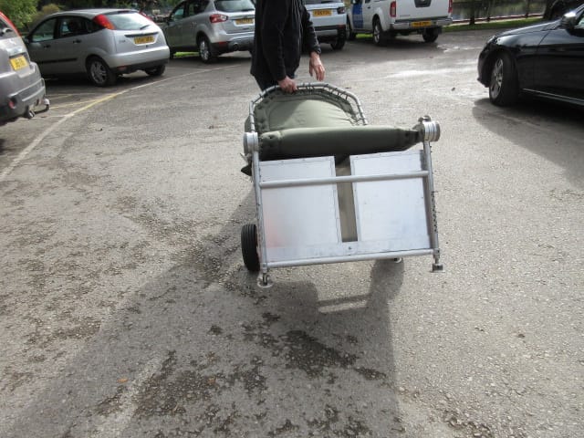 Carp Fishing Trolley being wheeled along as a trolley